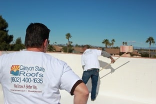Roofing Team Working On A Commercial Flat Roof