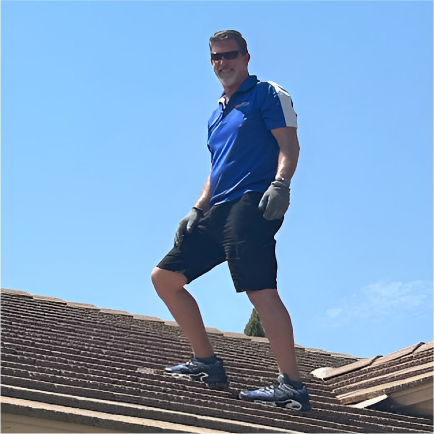Jim McLain, Owner Of Canyon State Roofing, Inspecting a Roof